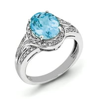 Prsten od srebra s dijamantom i ovalnim plavim topazom od 0,15 karata. Težina dragulja - 3,25 karata